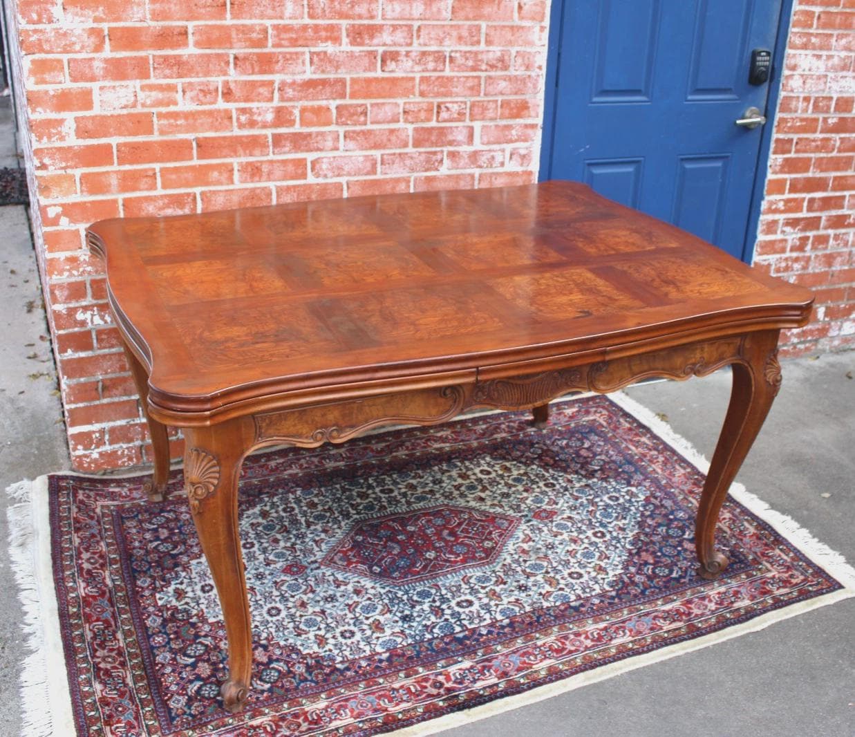 French Antique Louis XV Burled Walnut Dining Table | Carved Floral Apron